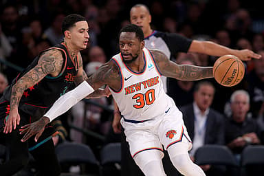 Jan 18, 2024; New York, New York, USA; New York Knicks forward Julius Randle (30) controls the ball against Washington Wizards forward Kyle Kuzma (33) during the third quarter at Madison Square Garden. Mandatory Credit: Brad Penner-USA TODAY Sports