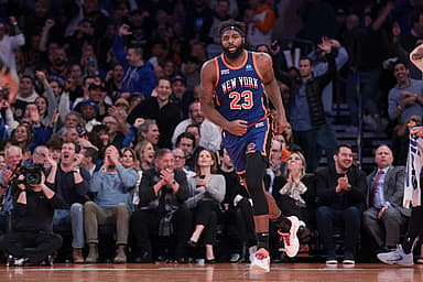 Nov 28, 2023; New York, New York, USA; New York Knicks center Mitchell Robinson (23) reacts after a dunk during the second half against the Charlotte Hornets at Madison Square Garden. Mandatory Credit: Vincent Carchietta-Imagn Images