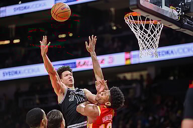 San Antonio Spurs forward Isaiah Roby (18, New York Knicks) shoots over Atlanta Hawks forward De'Andre Hunter (12) in the second quarter at State Farm Arena