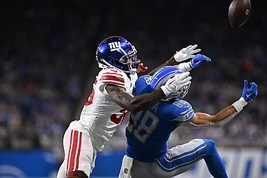 New York Giants cornerback Deonte Banks (36) breaks up a pass intended for Detroit Lions wide receiver Chase Cota (88) in the first quarter at Ford Field