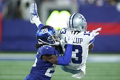 New York Giants cornerback Deonte Banks (25) breaks up a pass intended for Dallas Cowboys wide receiver Michael Gallup (13) during the first half at MetLife Stadium