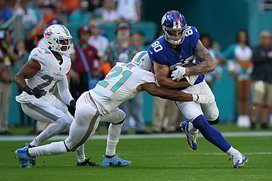 Miami Dolphins free safety Eric Rowe (21) tackles New York Giants tight end Kyle Rudolph (80) during the first half at Hard Rock Stadium