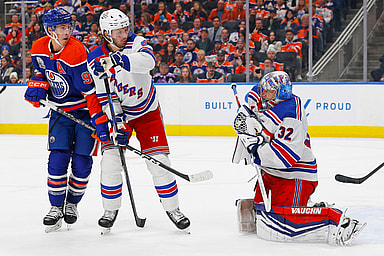 Edmonton Oilers forward Ryan Nugent-Hopkins (93) and New York Rangers defensemen Jacob Trouba (8) battle in front of New York Rangers goaltender Jonathan Quick (32) as he makes a save during the third period at Rogers Place