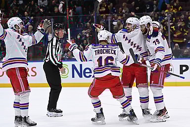 New York Rangers defence K'Andre Miller (79) celebrates a goal with teammates against the Vancouver Canucks during the overtime period at Rogers Arena