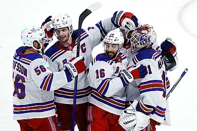 New York Rangers players celebrate their overtime win against the Winnipeg Jets at Canada Life Centre