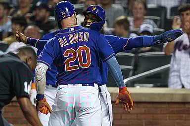 New York Mets first baseman Pete Alonso (20) celebrates with shortstop Francisco Lindor (12) after hitting a two-run home run during the third inning against the Chicago Cubs at Citi Field