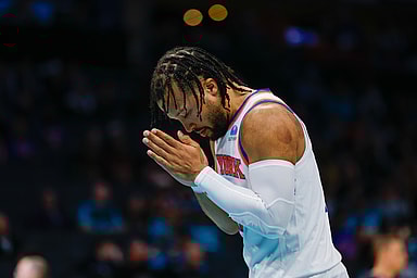 New York Knicks guard Jalen Brunson (11) pauses for a moment before the start of the game against the Charlotte Hornets at Spectrum Center