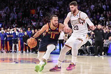 New York Knicks guard Jalen Brunson (11) drives past Phoenix Suns center Jusuf Nurkic (20) in the fourth quarter at Madison Square Garden