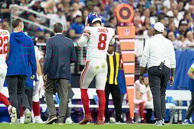 New York Giants quarterback Daniel Jones (8) walks to the sideline after an injury against the Las Vegas Raiders during the second quarter at Allegiant Stadium