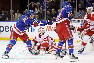 New York Rangers left wing Jimmy Vesey (26) scores the game winning goal against Detroit Red Wings goaltender Ville Husso (35) and defenseman Justin Holl (3) during the third period at Madison Square Garden