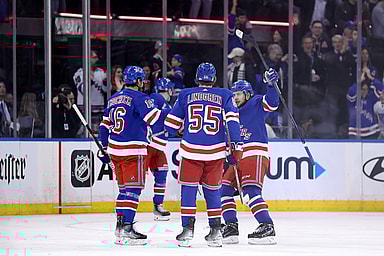 New York Rangers center Vincent Trocheck (16) celebrates his goal against the Minnesota Wild with defenseman Ryan Lindgren (55) and left wing Artemi Panarin (10) during the first period at Madison Square Garden