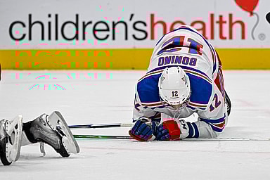 New York Rangers center Nick Bonino (12) falls to the ice during the third period against the Dallas Stars at the American Airlines Center