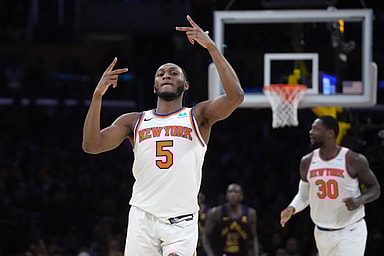 New York Knicks guard Immanuel Quickley (5) celebrates against the Los Angeles Lakers in the second half at Crypto.com Arena