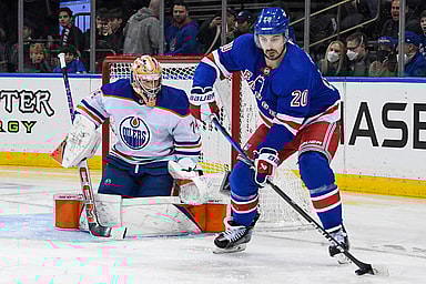 New York Rangers left wing Chris Kreider (20) plays the puck in front of Edmonton Oilers goaltender Stuart Skinner (74) during the second period at Madison Square Garden