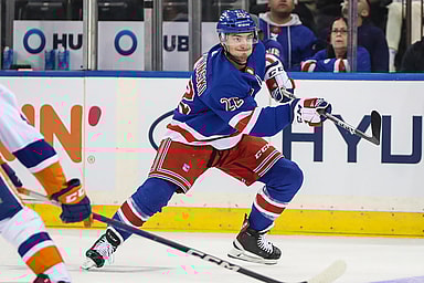 New York Rangers center Jonny Brodzinski (22) passes the puck in the first period against the New York Islanders at Madison Square Garden