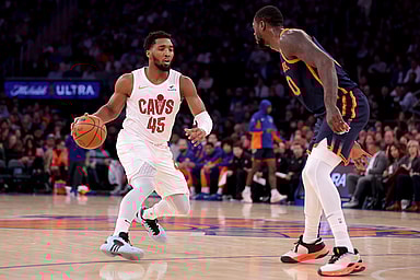 Cleveland Cavaliers guard Donovan Mitchell (45) controls the ball against New York Knicks forward Julius Randle (30) during the first quarter at Madison Square Garden