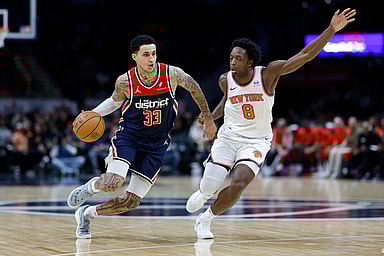 Washington Wizards forward Kyle Kuzma (33) drives to the basket as New York Knicks forward OG Anunoby (8) defends in the third quarter at Capital One Arena