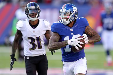New York Giants wide receiver Odell Beckham Jr. (13) runs for a touchdown against Baltimore Ravens corner back Will Davis (31) during the fourth quarter at MetLife Stadium