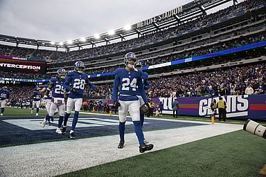 New York Giants safety Dane Belton (24) celebrates with teammates after an interception during the second half against the Los Angeles Rams at MetLife Stadium
