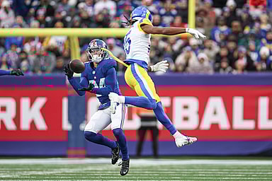 New York Giants safety Dane Belton (24) intercepts a pass intended for Los Angeles Rams wide receiver Demarcus Robinson (15) during the second half at MetLife Stadium