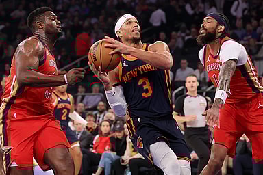 New York Knicks guard Josh Hart (3) drives to the basket against New Orleans Pelicans forwards Zion Williamson (1) and Brandon Ingram (14) during the first quarter at Madison Square Garden