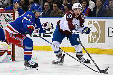 New York Rangers defenseman Erik Gustafsson (56) and Colorado Avalanche center Ross Colton (20) battle over the puck during the second period at Madison Square Garden