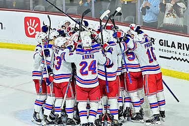 The New York Rangers celebrate after beating the Arizona Coyotes at Mullett Arena
