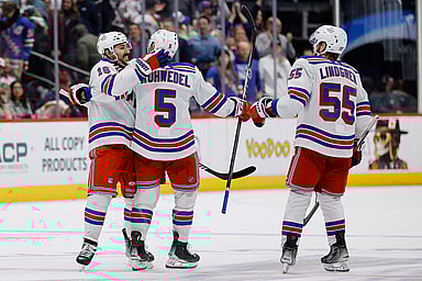 New York Rangers center Vincent Trocheck (16) celebrates with defenseman Chad Ruhwedel (5) and defenseman Ryan Lindgren (55) after the game against the Colorado Avalanche at Ball Arena