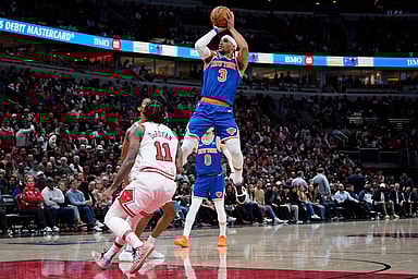 New York Knicks guard Josh Hart (3) shoots over Chicago Bulls forward DeMar DeRozan (11) during the second half at United Center
