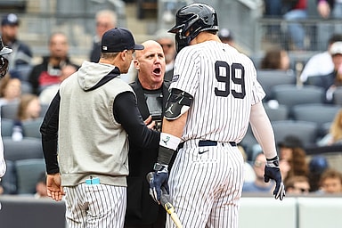 May 4, 2024; Bronx, New York, USA;  New York Yankees center fielder Aaron Judge (99) and manager Aaron Boone (17) argue with home plate umpire Ryan Blakney (36) in the seventh inning against the Detroit Tigers at Yankee Stadium. Mandatory Credit: Wendell Cruz-USA TODAY Sports