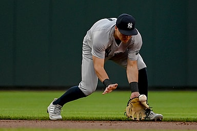 May 1, 2024; Baltimore, Maryland, USA; New York Yankees shortstop Anthony Volpe (11) fields a ground ball during the first inning against the Baltimore Orioles  at Oriole Park at Camden Yards. Mandatory Credit: Tommy Gilligan-USA TODAY Sports
