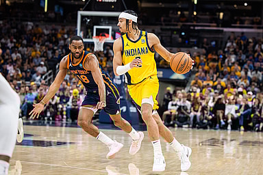 May 12, 2024; Indianapolis, Indiana, USA;  Indiana Pacers guard Andrew Nembhard (2) dribbles the ball while  New York Knicks guard Alec Burks (18) defends during game four of the second round for the 2024 NBA playoffs at Gainbridge Fieldhouse. Mandatory Credit: Trevor Ruszkowski-USA TODAY Sports