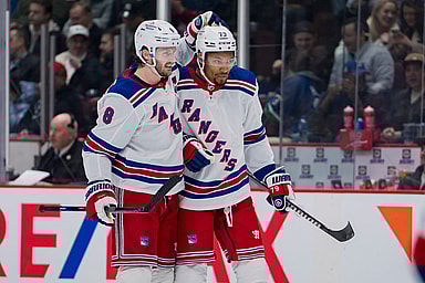 Feb 15, 2023; Vancouver, British Columbia, CAN; New York Rangers defenseman Jacob Trouba (8) celebrates defenseman K'Andre Miller (79) goal against the Vancouver Canucks in the second period at Rogers Arena. Mandatory Credit: Bob Frid-USA TODAY Sports
