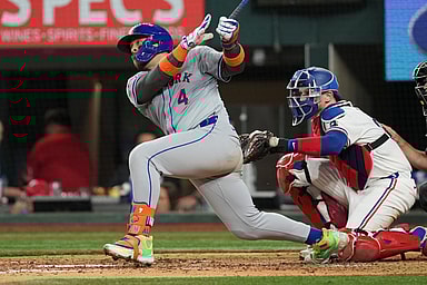 Jun 17, 2024; Arlington, Texas, USA; New York Mets catcher Francisco Alvarez (4) follows through on his RBI single against the Texas Rangers during the sixth inning at Globe Life Field. Mandatory Credit: Jim Cowsert-USA TODAY Sports