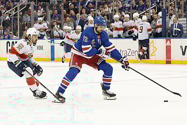May 24, 2024; New York, New York, USA;  New York Rangers center Filip Chytil (72) plays the puck in front of Florida Panthers left wing Ryan Lomberg (94) during the first period in game two of the Eastern Conference Final of the 2024 Stanley Cup Playoffs at Madison Square Garden. Mandatory Credit: Vincent Carchietta-USA TODAY Sports
