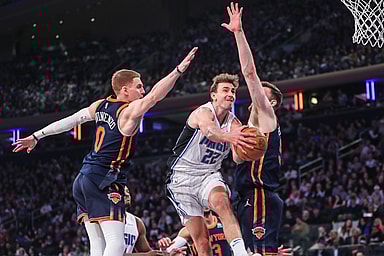Mar 8, 2024; New York, New York, USA;  Orlando Magic forward Franz Wagner (22) drives in between New York Knicks guard Donte DiVincenzo (0) and center Isaiah Hartenstein (55) in the first quarter at Madison Square Garden. Mandatory Credit: Wendell Cruz-USA TODAY Sports