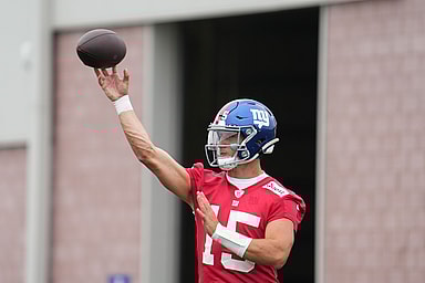 Jul 25, 2024; East Rutherford, NY, USA; New York Giants quarterback Tommy DeVito (15) throws a pass during training camp at Quest Diagnostics Training Center. Mandatory Credit: Lucas Boland-USA TODAY Sports