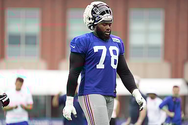 Jul 25, 2024; East Rutherford, NY, USA; New York Giants offensive tackle Andrew Thomas (78) takes a water break during training camp at Quest Diagnostics Training Center. Mandatory Credit: Lucas Boland-USA TODAY Sports