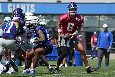 Jul 26, 2024; East Rutherford, NJ, USA; New York Giants quarterback Daniel Jones (8) fakes a handoff during training camp at Quest Diagnostics Training Center. Mandatory Credit: Lucas Boland-USA TODAY Sports