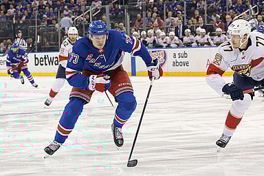 May 24, 2024; New York, New York, USA; New York Rangers center Matt Rempe (73) skates up ice as Florida Panthers defenseman Niko Mikkola (77) defends during the second period in game two of the Eastern Conference Final of the 2024 Stanley Cup Playoffs at Madison Square Garden. Mandatory Credit: Vincent Carchietta-USA TODAY Sports