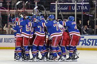 May 24, 2024; New York, New York, USA; New York Rangers center Barclay Goodrow (21) celebrates his game-winning overtime goal with teammates in game two of the Eastern Conference Final of the 2024 Stanley Cup Playoffs against the Florida Panthers at Madison Square Garden. Mandatory Credit: Vincent Carchietta-USA TODAY Sports