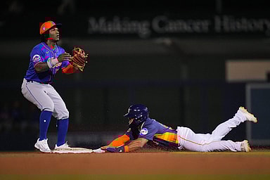 Feb 29, 2024; West Palm Beach, Florida, USA;  Houston Astros outfielder Pedro Leon steals second base as New York Mets second baseman Luisangel Acuna (73) waits for the ball in the seventh inning at The Ballpark of the Palm Beaches. Mandatory Credit: Jim Rassol-USA TODAY Sports