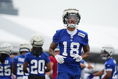 Jul 25, 2024; East Rutherford, NY, USA; New York Giants wide receiver Isaiah Hodgins (18) jogs onto the field during training camp at Quest Diagnostics Training Center. Mandatory Credit: Lucas Boland-USA TODAY Sports