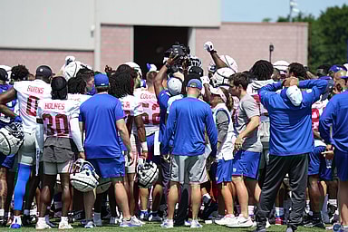 Jul 26, 2024; East Rutherford, NJ, USA; New York Giants players huddle at the end of training camp at Quest Diagnostics Training Center. Mandatory Credit: Lucas Boland-USA TODAY Sports