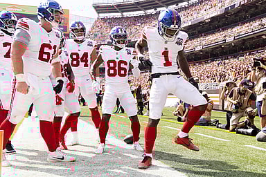Sep 22, 2024; Cleveland, Ohio, USA; New York Giants wide receiver Malik Nabers (1) celebrates his touchdown with teammates against the Cleveland Browns during the second quarter at Huntington Bank Field. Mandatory Credit: Scott Galvin-Imagn Images