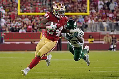 Sep 9, 2024; Santa Clara, California, USA; San Francisco 49ers running back Jordan Mason (24) rushes by New York Jets safety Tony Adams (22) in the fourth quarter at Levi's Stadium. Mandatory Credit: David Gonzales-Imagn Images