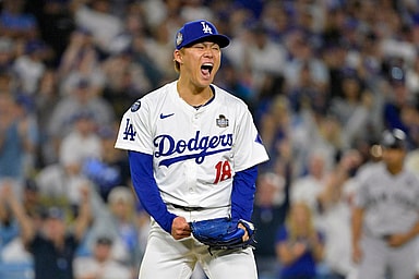 Oct 26, 2024; Los Angeles, California, USA; Los Angeles Dodgers pitcher Yoshinobu Yamamoto (18) reacts in the sixth inning against the New York Yankees during game two of the 2024 MLB World Series at Dodger Stadium. Mandatory Credit: Jayne Kamin-Oncea-Imagn Images