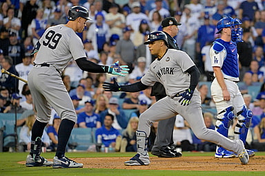 Oct 26, 2024; Los Angeles, California, USA; New York Yankees outfielder Juan Soto (22) celebrates with outfielder Aaron Judge (99) after hitting a solo home run in the third inning against the Los Angeles Dodgers during game two of the 2024 MLB World Series at Dodger Stadium. Mandatory Credit: Jayne Kamin-Oncea-Imagn Images