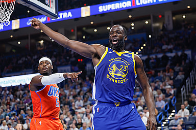 Nov 10, 2024; Oklahoma City, Oklahoma, USA; Golden State Warriors forward Draymond Green (23) and Oklahoma City Thunder guard Luguentz Dort (5) react after a play during the second quarter at Paycom Center. Mandatory Credit: Alonzo Adams-Imagn Images
