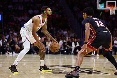 Oct 30, 2024; Miami, Florida, USA; New York Knicks guard Cameron Payne (1) dribbles the basketball as Miami Heat guard Dru Smith (12) defends during the third quarter at Kaseya Center. Mandatory Credit: Sam Navarro-Imagn Images